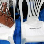 Una silla con el nombre de Mariano Rajoy en un mitin del partido en Barcelona en 2010