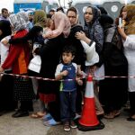 Un grupo de refugiado en Atenas