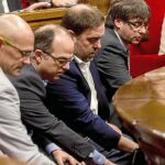 En la imagen, Carles Puigdemont, Oriol Junqueras, Jordi Turull y Raül Romeva, ayer en el último pleno antes del periodo vacacional