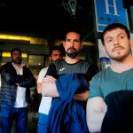 Varios miembros de la Brigada de Salvamento Minero a la salida del hotel para volver a Asturias
