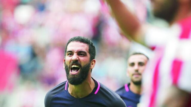 Arda celebra un gol contra el Sporting en El Molinón esta temporada