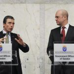 Rasmussen y Fredrik Reinfeldt, primer ministro sueco