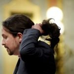 El líder de Unidas Podemos, Pablo Iglesias, durante su intervención ante el pleno del Congreso de los Diputados en la primera jornada de la sesión de investidura de Pedro Sánchez como presidente del Gobierno