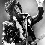 FILE - In this Jan. 22, 1985 file photo, Prince performs in concert at Riverfront Coliseum during his Purple Rain Tour in Cincinnati, Ohio. Prince's publicist has confirmed that Prince died at his his home in Minnesota, Thursday, April 21, 2016. He was 57. (AP Photo/Rob Burns, File)