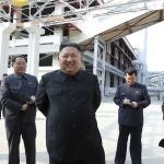 FILE- In this Friday, May 1, 2020, file photo provided by the North Korean government, North Korean leader Kim Jong Un, center, visits a fertilizer factory in Sunchon, South Pyongan province, near Pyongyang, North Korea. The coronavirus pandemic appears to be taking a heavy toll on North Korea, forcing its Kim to sharply shrink his public activities and his people to go on panic buying of daily necessities, South Korea's spy agency told lawmaker Wednesday, May 6, 2020. Korean language watermark on image as provided by source reads: "KCNA" which is the abbreviation for Korean Central News Agency. (Korean Central News Agency/Korea News Service via AP, File)