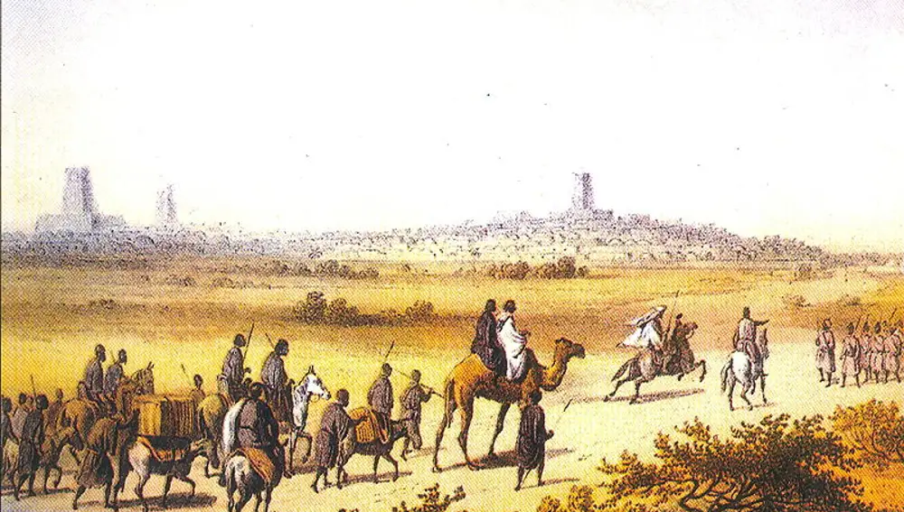 Grabado que representa a mercaderes berberes entrando en Tombuctú sobre 1300.