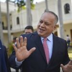 FILE- In this Jan. 8, 2020 file photo, Diosdado Cabello, president of the National Constituent Assembly, jokes with lawmakers after giving a press conference at the National Assembly in Caracas, Venezuela. Cabello has announced on Thursday, July 9, 2020, that he tested positive for COVID-19. (AP Photo/Matias Delacroix, File)