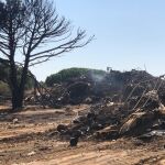 Chabolas calcinadas en el asentamiento de Lepe