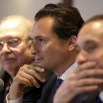 FILE - In this Aug. 17, 2017 file photo, flanked by his lawyers, Emilio Lozoya, former head of Mexico's state-owned oil company Pemex, attends a press conference in Mexico City. The alleged examples of kickbacks, bribes and graft contained in accusations by Lozoya on Wednesday, Aug. 20, 2020, include that one government contractor gave then-President Enrique Pena Nieto a Ferrari sports car. (AP Photo/Gustavo Martinez Contreras, File)
