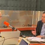 Juanma Moreno (d) durante la entrevista de este lunes en Canal Sur