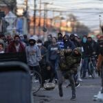 09 September 2020, Colombia, Bogota: A demonstrator throws a stone at police officers during a demonstration over the death of a man after a police operation. Photo: Sergio Acero/colprensa/dpa09/09/2020 ONLY FOR USE IN SPAIN