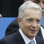 FILE - In this Aug. 7, 2018 file photo, Colombia's former President and Senator Alvaro Uribe arrives to the inauguration ceremony for Colombia's new president Ivan Duque in Bogota, Colombia. Uribe has been ordered freed from house arrest while he is investigated for possible witness tampering. A judge ordered Uribeâ€™s release Saturday, Oct. 10, 2020, in a case that has divided the South American nation and exposed lingering tensions over Colombiaâ€™s peace accord for ending a half-century conflict with leftist guerrillas. (AP Photo/Fernando Vergara, File)