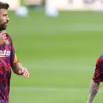 Gerard Piqué y Leo Messi