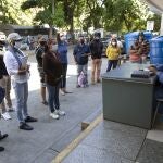 Dr. Wilfredo Sifontes, right, speaks to families who have family hospitalized in the COVID-19 wing, outside JosÃ© Gregorio HernÃ¡ndez Hospital in the Catia neighborhood of Caracas, Venezuela, Friday, Sept 4, 2020. Sifontes, who oversees the hospitalâ€™s emergency services including its coronavirus wing, described having a fever, cough and feeling sick. Though he oversees testing kits, he himself was never tested and continued to clock in. He dismissed the threat of the coronavirus, comparing it to a â€œcommon fluâ€ thatâ€™s sparked needless panic. (AP Photo/Ariana Cubillos)