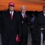 President Donald Trump and Vice President Mike Pence arrive for a campaign rally at Cherry Capital Airport