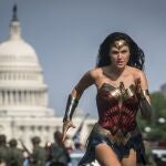 This image released by Warner Bros. Pictures shows Gal Gadot as Wonder Woman in a scene from "Wonder Woman 1984." The film isn't skipping theaters or moving to 2021, but it is altering course. The last big blockbuster holdout of 2020 is still opening in U.S. theaters on Christmas Day but it will also be made available to HBO Max subscribers free of charge for its first month, Warner Bros. said Wednesday, Nov. 18, 2020. (Clay Enos/Warner Bros Pictures via AP)
