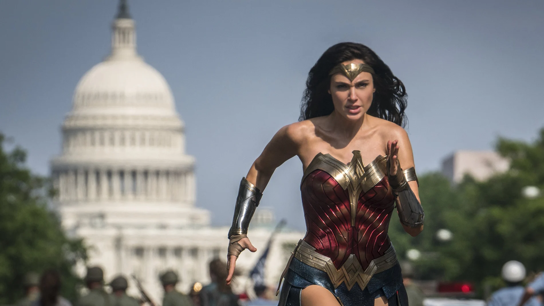This image released by Warner Bros. Pictures shows Gal Gadot as Wonder Woman in a scene from "Wonder Woman 1984." The film isn't skipping theaters or moving to 2021, but it is altering course. The last big blockbuster holdout of 2020 is still opening in U.S. theaters on Christmas Day but it will also be made available to HBO Max subscribers free of charge for its first month, Warner Bros. said Wednesday, Nov. 18, 2020. (Clay Enos/Warner Bros Pictures via AP)