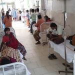 Patients and their bystanders are seen at the district government hospital in Eluru, Andhra Pradesh state, India, Sunday, Dec.6, 2020. Over 200 people have been hospitalized due to an unidentified illness in this ancient city famous for its hand woven products. (AP Photo)