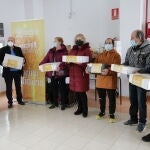 Entrega de cestas de Navidad a familias beneficiarias de la Cocina Solidaria, promovida por Caja Rural y Asezpan