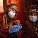 Bolivian President Luis Arce, left, and Vice President David Choquehuanca hold pre-Hispanic objects during a presentation ceremony at an archaeologyical museum in Tiwanaku, Bolivia, Tuesday, Jan. 12, 2021. Bolivian archaeologists and government officials are presenting the findings of a recent discovery of ancient vessels unearthed in a dig on the site once home to one of the most significant pre-Hispanic empires, the Tiwanacota. (AP Photo/Juan Karita)