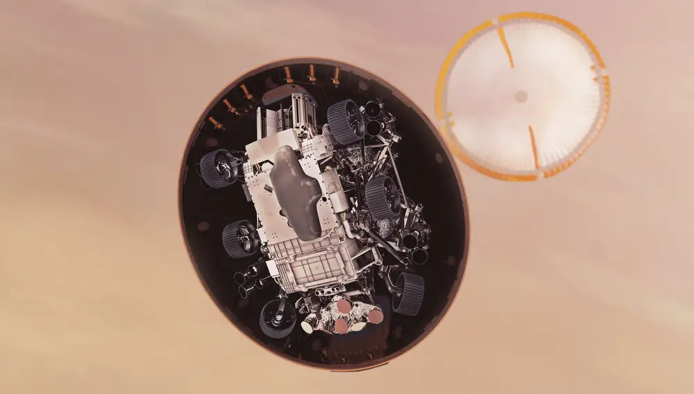 In this illustration made available by NASA, the Perseverance rover gets its first look at the Martian surface below, after ejecting its heat shield just under six minutes after entry into the Mars atmosphere. (NASA/JPL-Caltech via AP)