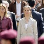 FILE - In this Wednesdday, April 16, 2008 file photo, Spain's Princess Cristina, left and Princess Elena, listen to the Spanish national anthem during a ceremony, upon their arrival for the opening of the Spanish Parliament, after Jose Luis Rodriguez Zapatero's Socialist Party won the general elections on March 9, in Madrid. The sisters of Spanish King Felipe VI have acknowledged on Wednesday, March 3, 2021, that they were administered COVID-19 vaccines during a visit to the United Arab Emirates. In a statement published by a Spanish newspaper, the Infantas Elena and Cristina said that they were â€œoffered the possibilityâ€ of receiving vaccines while in Abu Dhabi to visit their father and former monarch, Juan Carlos I. (AP Photo/Daniel Ochoa de Olza, File)