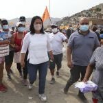 Wearing a mask to curb the spread of the new coronavirus, presidential candidate and daughter of imprisoned ex-President Alberto Fujimori, Keiko Fujimori, of the Popular Force party, campaigns in San Juan de Lurigancho on the outskirts of Lima, Peru, Tuesday, March 16, 2021. Peru's general election is set for April 11. (AP Photo/Martin Mejia)