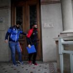 Former Catholic Priest Andres Gioeni, right, leaves the bishopric with his husband Luis Iarocci, where he started the process of apostasy in Buenos Aires, Argentina, Wednesday, March 17, 2021. Gioeni, who left the priesthood 20 years ago and married in 2014, said he has decided to formally leave the church after the Vatican decreed that the Catholic Church cannot bless same-sex unions since God â€˜cannot bless sin.â€™ (AP Photo/Natacha Pisarenko)
