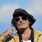 FILE - In this file photo dated Sunday, Sept. 20, 2020, US actor and film producer Johnny Deep during the photocall for his film "Crock of Gold: A Few Rounds with Shane Macgoman" at the 68th San Sebastian Film Festival, in San Sebastian, northern Spain. Appeal judges said the Hollywood star cannot challenge the High Courtâ€™s rejection of his libel lawsuit against publisher of The Sun newspaper for labeling him a â€œwife beaterâ€ in an article. High Court Justice Andrew Nicol ruled in November that allegations against Depp, made in a April 2018 article, were â€œsubstantially true.â€ The judges said Thursday that the earlier court hearing was â€œfull and fairâ€ and the justiceâ€™s conclusions â€œhave not been shown even arguably to be vitiated by any error of approach or mistake of law.â€ (AP Photo/Alvaro Barrientos, File)