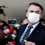 FILE PHOTO: Brazil's President Jair Bolsonaro is seen after a meeting with Brazil's Lower House Arthur Lira at the Planalto Palace, in Brasilia, Brazil, March 25, 2021. REUTERS/Ueslei Marcelino/File Photo