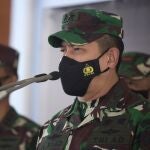 Indonesian military spokesperson Maj. Gen. Achmad Riad, center, talks to reporters during a press conference at the Ngurah Rai airport in Bali, Indonesia on Thursday, April 22, 2021. Indonesia's navy ships are intensely searching the waters where one of its submarines was last detected before it disappeared, as neighboring countries are set to join the complex operation. (AP Photo/Firdia Lisnawati)