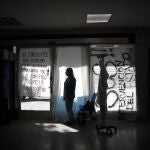 Nurse Lidia Del Valle stands inside San Andres Clinic which has been occupied by its former workers since it closed at the start of the year following the death of the hospital's director and owner in Caseros, Argentina, Friday, April 30, 2021. While the pandemic has swelled the need for hospital beds, many private clinics say they're struggling to survive, citing the pandemic having pushed away many non-COVID patients and losing money on coronavirus sufferers because the government insurance program doesn't pay enough to meet costs. (AP Photo/Natacha Pisarenko)