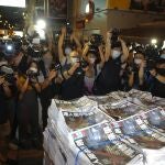 Last issue of Apple Daily arrive at a newspaper booth in Hong Kong, early Thursday, June 24, 2021. Hong Kong's pro-democracy Apple Daily newspaper will stop publishing Thursday, following last week's arrest of five editors and executives and the freezing of $2.3 million in assets under the city's year-old national security law. (AP Photo/Vincent Yu)