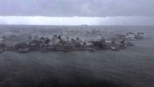 Looking north at the neighborhood of Paradise Island on Treasure Island, Fla., outer bands of Tropical Storm Elsa brings a downpour of rain over the area on Tuesday afternoon, July 6, 2021. Elsa is expected to impact the Tampa Bay area the heaviest during the predawn hours of Wednesday morning. (Marc Topkin/Tampa Bay Times via AP)