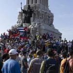 CORRECTS TO GOVERNMENT SUPPORTERS - Government supporters gather at the Maximo Gomez monument in Havana, Cuba, Sunday, July 11, 2021. Supporters of the government took to the streets at the time hundreds more protested against ongoing food shortages and high prices of foodstuffs.. (AP Photo/Eliana Aponte)