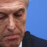 FILE - In this Aug. 12, 2019 file photo, Argentine President Mauricio Macri, who is running for reelection, pauses during a press conference at the government house the day after primary elections in Buenos Aires, Argentina. The government of Argentina has charged Macri on Monday, July 12, 2021, in a case of smuggling of arms to help the government of BoliviaÂ´s then self-proclaimed interim President Jeanine Ãnez. (AP Photo/Natacha Pisarenko, File)