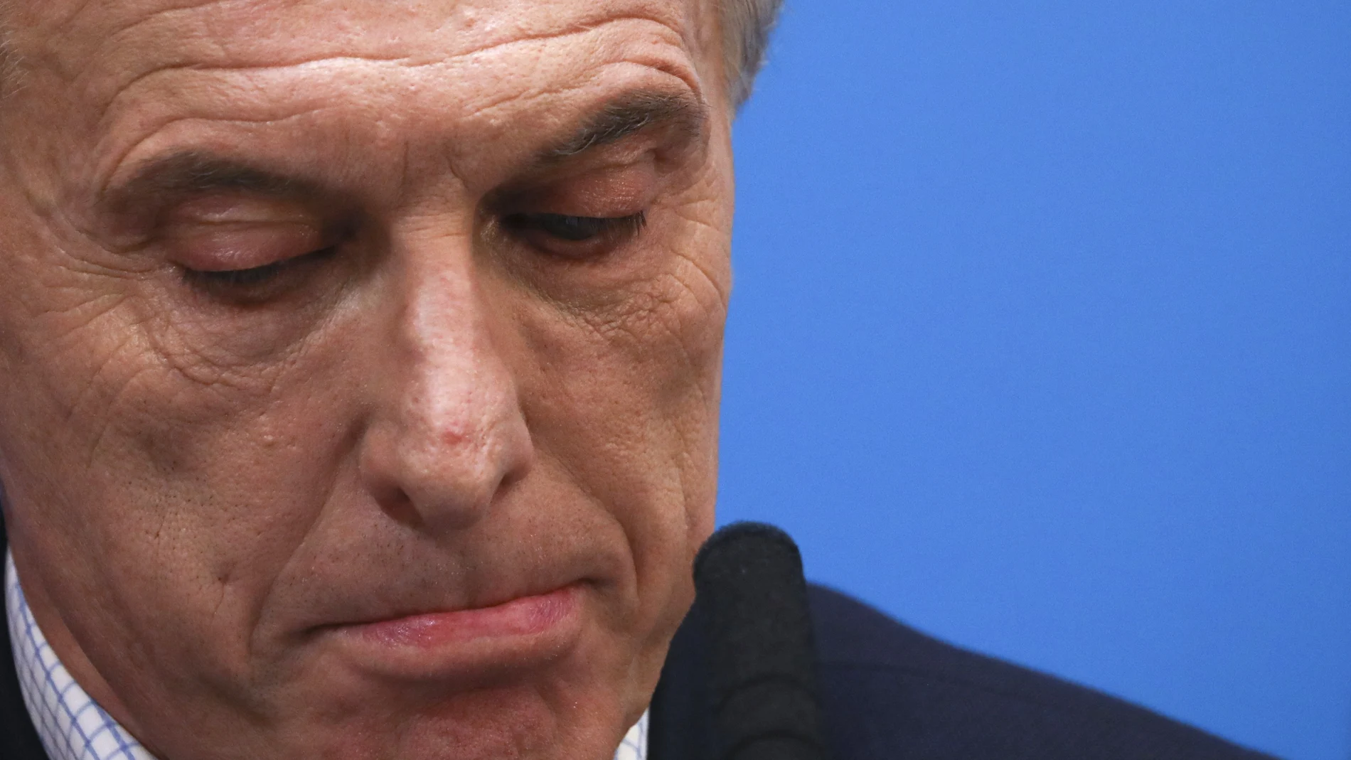 FILE - In this Aug. 12, 2019 file photo, Argentine President Mauricio Macri, who is running for reelection, pauses during a press conference at the government house the day after primary elections in Buenos Aires, Argentina. The government of Argentina has charged Macri on Monday, July 12, 2021, in a case of smuggling of arms to help the government of Bolivia´s then self-proclaimed interim President Jeanine Ãnez. (AP Photo/Natacha Pisarenko, File)