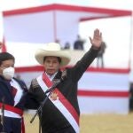 Peru's President Pedro Castillo, right, and his Prime Minister Guido Bellido pose for photos after a symbolic swearing-in ceremony at the site of the 1824 Battle of Ayacucho, which sealed independence from Spain, at the Pampa de la Quinua as part of PeruÂ´s bicentennial celebrations in Ayacucho, Peru, Thursday, July 29, 2021, the day after he was officially sworn in as president. (AP Photo/Ernesto Arias)