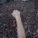 FILE - In this June 16, 2019, file photo, protesters march on the streets against an extradition bill organized by Civil Human Right Front in Hong Kong. Pro-democracy group, Civil Human Rights Front that organized some of the biggest protests during the months of upheaval in Hong Kong in 2019 is dissolving, the group said Sunday, Aug. 15, 2021. (AP Photo/Vincent Yu, File)