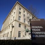 FILE - This Jan. 28, 2015, file photo, shows the Federal Trade Commission building in Washington. The Federal Trade Commission has for the first time banned a company that makes so-called stalkerware â€” software used to surreptitiously track a cellphone user's activities and location â€” from continuing in the surveillance app business. The action Wednesday, Sept. 1, 2021, applies to the marketer of SpyFone, Puerto Rico-based Support King LLC, and its CEO, Scott Zuckerman. (AP Photo/Alex Brandon, File)