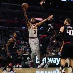 Oct 27, 2021; Los Angeles, California, USA; Cleveland Cavaliers guard Ricky Rubio (3) is defended by LA Clippers guard Reggie Jackson (1) in the second half at Staples Center. Mandatory Credit: Kirby Lee-USA TODAY Sports