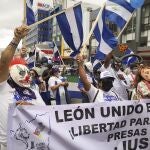 Nicaraguan citizens protest against President Daniel Ortega in San Jose, Costa Rica, Sunday, Nov. 7, 2021. Ortega seeks a fourth consecutive term against a field of little-known candidates while those who could have given him a real challenge sit in jail. (AP Photo/Javier Cordoba)