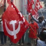 Activists of various organizations celebrate news of the repeal of farm laws they were protesting against in Hyderabad, India, Friday, Nov. 19, 2021. In a surprise announcement, India's Prime Minister Narendra Modi said Friday his government will withdraw the controversial agriculture laws that prompted yearlong protests from tens of thousands of farmers and posed a significant political challenge to his administration. (AP Photo/Mahesh Kumar A.)