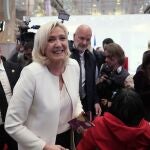 French far-right leader Marine Le Pen leaves after a press conference in Paris, Wednesday, April 13, 2022. Far-right leader Marine Le Pen on Tuesday described France as a nation that would put its people's voices at the center of the political process if she is elected president in 12 days. (AP Photo/Francois Mori)
