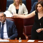 La presidenta de la Comunidad de Madrid, Isabel Díaz Ayuso, interviene en el pleno de la Asamblea de Madrid este jueves