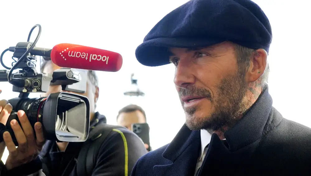 David Beckham speaks to the media after leaving Westminster Palace where he paid respects to the late Queen Elizabeth II, at Westminster Hall, London, England, Friday, Sept. 16, 2022. The Queen will lie in state in Westminster Hall for four full days before her funeral on Monday Sept. 19. (AP Photo/Markus Schreiber)