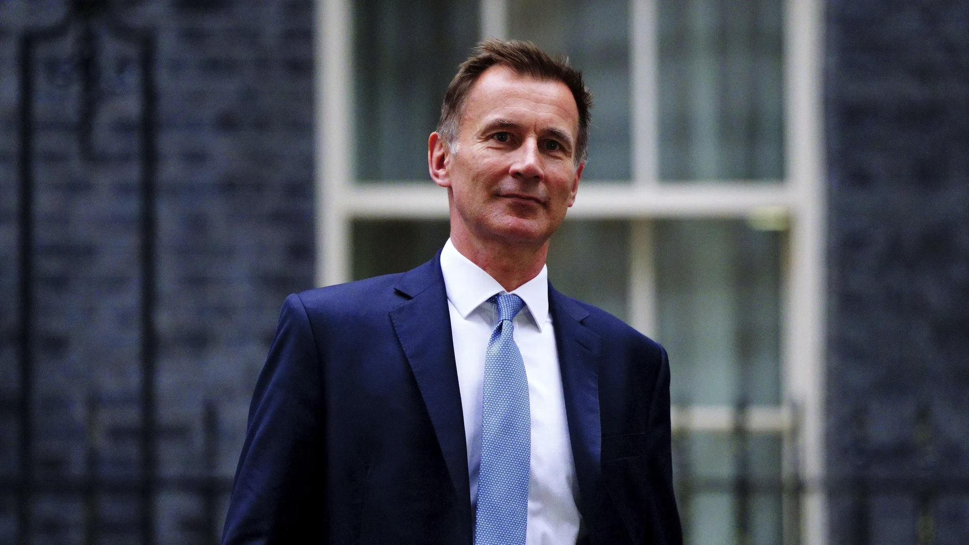 Jeremy Hunt leaves 10 Downing Street in London after he was appointed Chancellor of the Exchequer following the resignation of Kwasi Kwarteng, Friday Oct. 14, 2022. Chancellor of the Exchequer Kwasi Kwarteng said he has accepted Prime Minister Liz Truss' request he "stand aside" as Chancellor, paying the price for the chaos unleashed by his mini-budget. (Victoria Jones/PA via AP)
