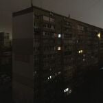 Windows of an apartment building are illuminated during a blackout in central Kyiv, Ukraine, Monday, Nov. 14, 2022. (AP Photo/Andrew Kravchenko)