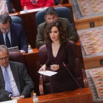La presidenta de la Comunidad de Madrid, Isabel Díaz Ayuso, interviene en el pleno de la Asamblea de Madrid, este jueves