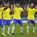 Brazil's Neymar, from right, celebrates with team mates Lucas Paqueta, Raphinha and Vinicius Junior after scoring his side's second goal during the World Cup round of 16 soccer match between Brazil and South Korea, at the Stadium 974 in Doha, Qatar, Monday, Dec. 5, 2022. (AP Photo/Manu Fernandez)